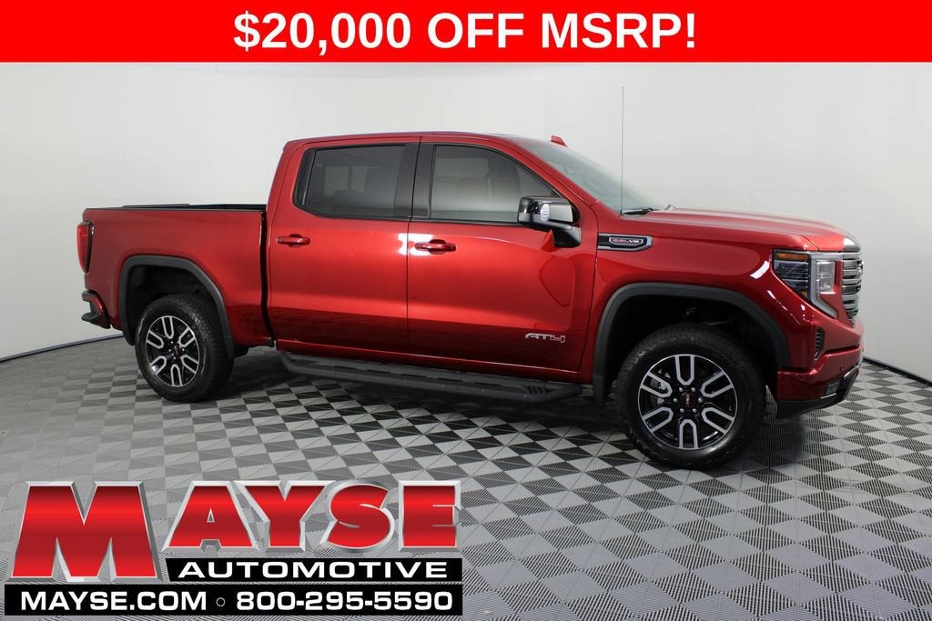 2026 GMC Sierra 1500 AT4 in Volcanic Red Tintcoat — front three-quarter view
